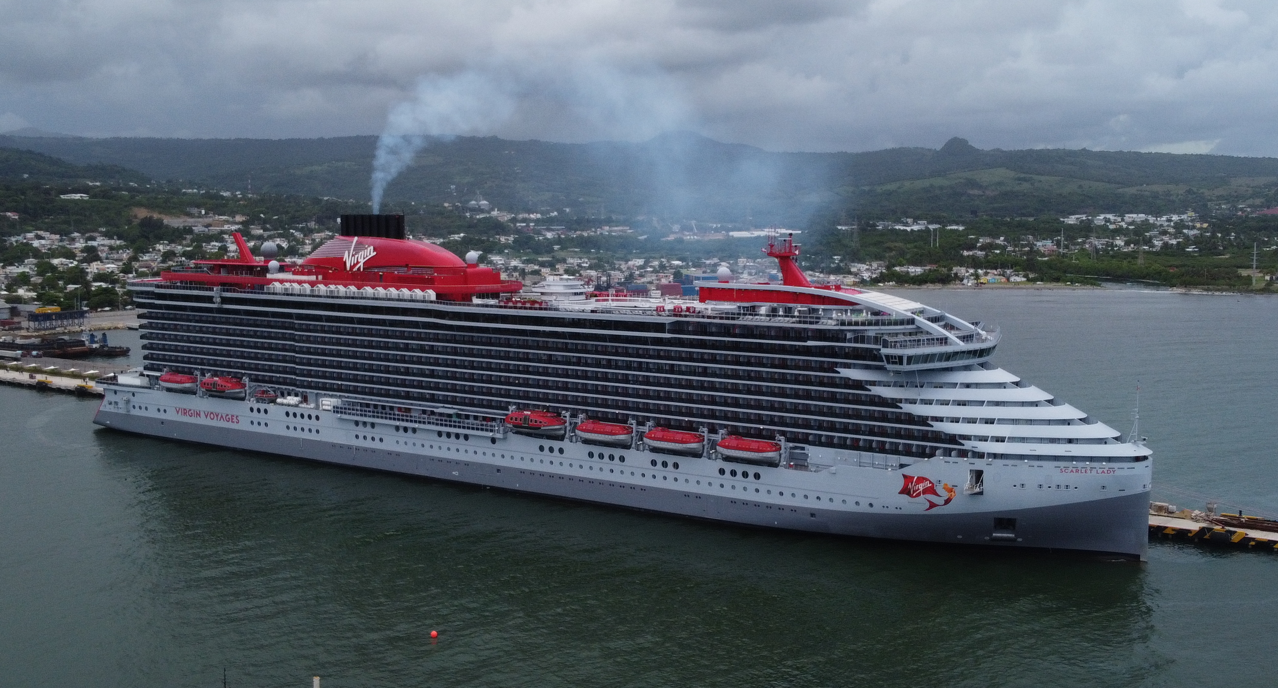 Virgin Voyages Scarlet Lady at a Caribbean port